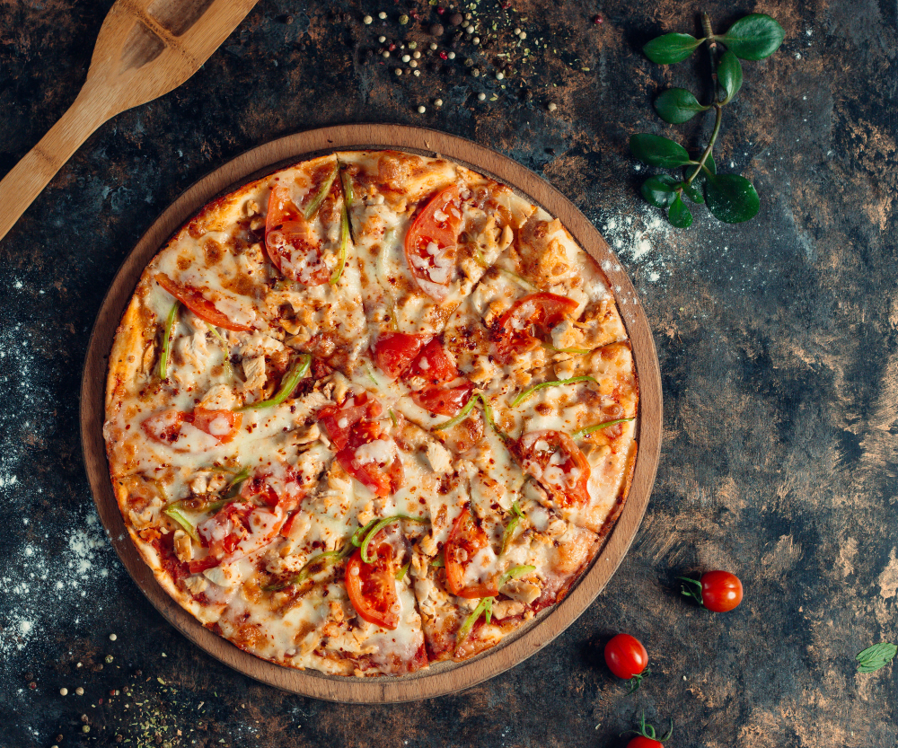 chicken pizza with bell peppers tomato cheese round wooden board