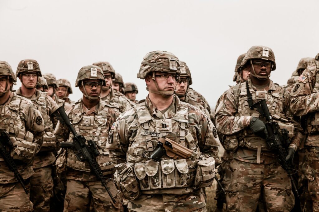 a group of soldiers holding rifles