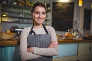 portrait smiling waitress standing counter