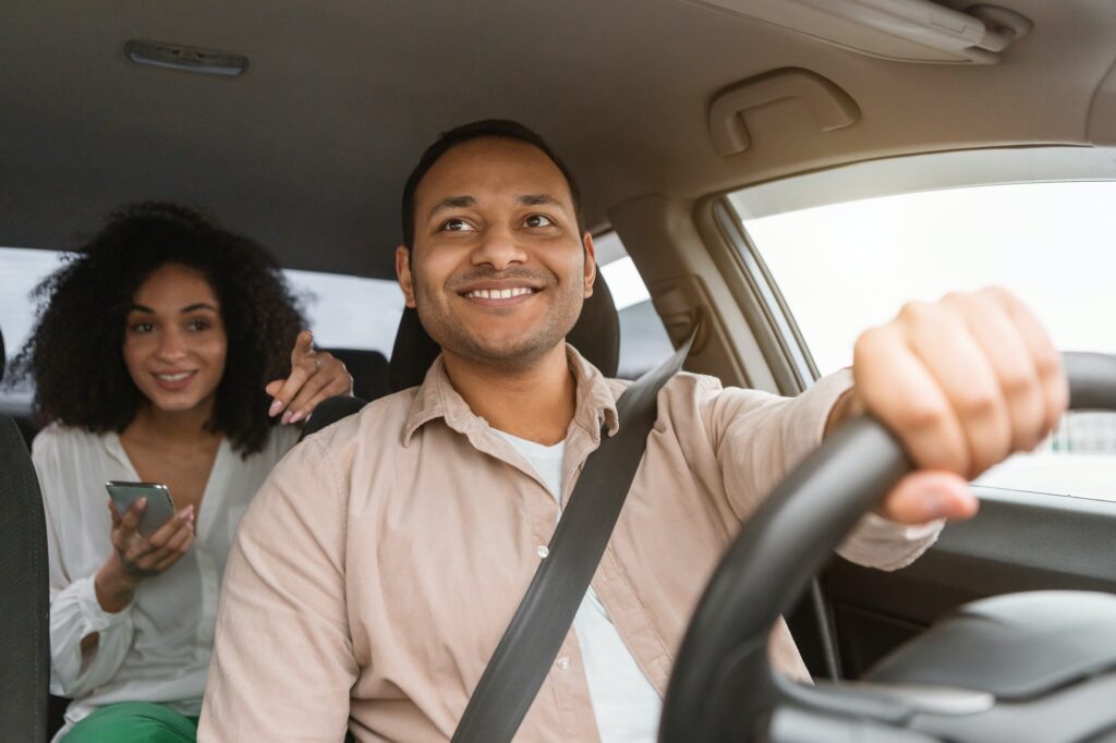 Lady With Phone Showing Route To Driver Man In Car