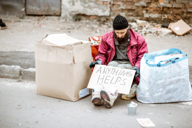 Homeless depressed beggar on the street